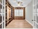 Spacious library with built-in wooden shelving at 327 Great Lawn Dr, Summerville, SC 29486