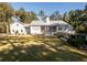 Home exterior showcasing a large backyard and screened porch at 3365 Westphal Dr, Johns Island, SC 29455