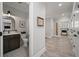 Small bathroom with dark vanity, patterned floor, and access to laundry room at 3365 Westphal Dr, Johns Island, SC 29455