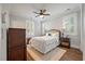 Cozy bedroom with queen-size bed, hardwood floors, and plantation shutters at 3365 Westphal Dr, Johns Island, SC 29455