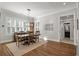 Spacious dining area with hardwood floors and plantation shutters at 3365 Westphal Dr, Johns Island, SC 29455