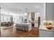 Modern kitchen with white cabinets, large island, and stainless steel appliances at 3365 Westphal Dr, Johns Island, SC 29455