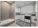 Laundry room with gray tile, white cabinets, and a dog shower at 3365 Westphal Dr, Johns Island, SC 29455