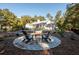 Stunning pool with fire pit and seating area, overlooking the home at 3365 Westphal Dr, Johns Island, SC 29455