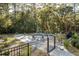 Relaxing kidney-shaped pool with paver patio and surrounding landscaping at 3365 Westphal Dr, Johns Island, SC 29455