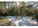 Inviting pool area with patio seating and umbrella for shade at 3365 Westphal Dr, Johns Island, SC 29455