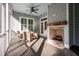 Cozy screened porch with fireplace and seating area, perfect for relaxing at 3365 Westphal Dr, Johns Island, SC 29455