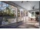 Relaxing screened porch with outdoor seating and wood flooring at 3365 Westphal Dr, Johns Island, SC 29455