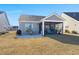 Home with screened porch and patio, overlooking yard at 487 Switchgrass Dr, Summerville, SC 29486