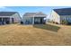 Home with screened porch and patio, overlooking yard at 487 Switchgrass Dr, Summerville, SC 29486