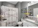 Clean bathroom with granite countertop and dragonfly shower curtain at 487 Switchgrass Dr, Summerville, SC 29486