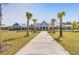 Community clubhouse with palm trees and walkway at 487 Switchgrass Dr, Summerville, SC 29486