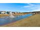 Waterfront community with lake, fountain, and manicured lawns; homes with backyard access at 487 Switchgrass Dr, Summerville, SC 29486