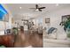 Open concept living area with hardwood floors and kitchen view at 487 Switchgrass Dr, Summerville, SC 29486