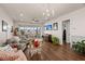 Bright living room with hardwood floors and sliding glass doors to patio at 487 Switchgrass Dr, Summerville, SC 29486