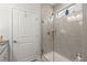 Bright bathroom with a large glass shower and grey tile at 487 Switchgrass Dr, Summerville, SC 29486