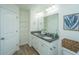 Double vanity bathroom with granite countertop, linen closet, and shower at 523 Truman Dr, Goose Creek, SC 29445