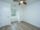 Bright bedroom with ceiling fan, window, and hardwood floors at 523 Truman Dr, Goose Creek, SC 29445