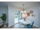 Bright dining area with white table, chairs, and access to a patio at 523 Truman Dr, Goose Creek, SC 29445