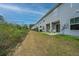 Back exterior view of townhouses with grassy backyards at 523 Truman Dr, Goose Creek, SC 29445