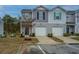 Two-story townhome with attached garage and manicured landscaping at 523 Truman Dr, Goose Creek, SC 29445