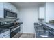 Kitchen with stainless steel appliances and white cabinets at 523 Truman Dr, Goose Creek, SC 29445