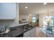 Kitchen with granite countertops, white cabinets, and a breakfast bar at 523 Truman Dr, Goose Creek, SC 29445