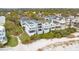 Aerial view of beach house and surrounding neighborhood at 58 Grand Pavilion Blvd, Isle of Palms, SC 29451