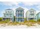 Three charming beach homes with multiple levels and balconies at 58 Grand Pavilion Blvd, Isle of Palms, SC 29451