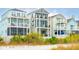 Three charming beach homes with multiple levels and balconies at 58 Grand Pavilion Blvd, Isle of Palms, SC 29451
