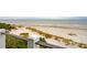Oceanfront view from balcony with white railing and dune landscape at 58 Grand Pavilion Blvd, Isle of Palms, SC 29451