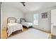 Charming bedroom with two twin beds and a window with shutters at 58 Grand Pavilion Blvd, Isle of Palms, SC 29451