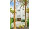 Two-story beach home with white siding, shutters, and a paved driveway at 58 Grand Pavilion Blvd, Isle of Palms, SC 29451