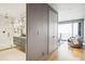Bright hallway with hardwood floors, leading to a bedroom with ocean views at 58 Grand Pavilion Blvd, Isle of Palms, SC 29451