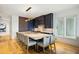 Contemporary kitchen with marble island and bar seating at 58 Grand Pavilion Blvd, Isle of Palms, SC 29451