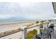 Beachfront view from deck with lounge chairs and ocean access at 58 Grand Pavilion Blvd, Isle of Palms, SC 29451