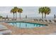 Inviting resort-style pool with plenty of surrounding lounge chairs at 58 Grand Pavilion Blvd, Isle of Palms, SC 29451