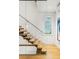 Modern staircase with glass and wood accents at 58 Grand Pavilion Blvd, Isle of Palms, SC 29451