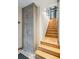 Elegant staircase with glass railings and wood flooring at 58 Grand Pavilion Blvd, Isle of Palms, SC 29451