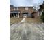 Brick townhouse with damaged windows and a small front yard at 7734 Suzanne Dr, North Charleston, SC 29418