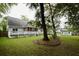 Spacious backyard with large trees and storage shed at 8245 Governors Walk, North Charleston, SC 29418