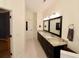 Double vanity bathroom with granite countertops and dark brown cabinets at 8245 Governors Walk, North Charleston, SC 29418
