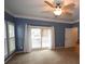Bedroom with sliding glass doors leading to a deck and carpet flooring at 8245 Governors Walk, North Charleston, SC 29418