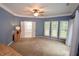 Spacious bedroom with neutral walls, carpet, and access to a bathroom at 8245 Governors Walk, North Charleston, SC 29418