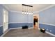 Spacious dining room with hardwood floors and two-toned walls at 8245 Governors Walk, North Charleston, SC 29418
