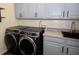 Laundry room with front-load washer and dryer, and a utility sink at 8245 Governors Walk, North Charleston, SC 29418