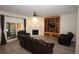 Living room with fireplace, built-in shelving, and leather furniture at 8245 Governors Walk, North Charleston, SC 29418