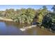 Aerial view of a private dock on a wooded waterway at 8382 Camp Gregg Ln, North Charleston, SC 29418