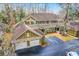 Aerial view of a two-story home with attached garage and driveway at 8382 Camp Gregg Ln, North Charleston, SC 29418