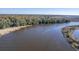 Aerial view of a tranquil river and lush landscape at 8382 Camp Gregg Ln, North Charleston, SC 29418